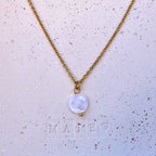 ROMY • Collier en acier inoxydable avec breloque ronde en coquillage