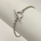 TAMARA • Bracelet demi-jonc fermoir T